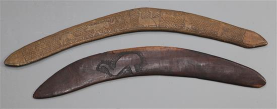 Two hardwood boomerangs, one carved with an emu, 55cm, the other a hunter and animals, 64cm